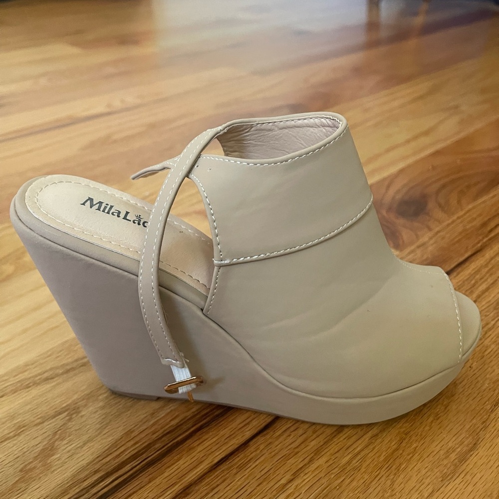 Nude colored wedge peep tie shoes, size 7.